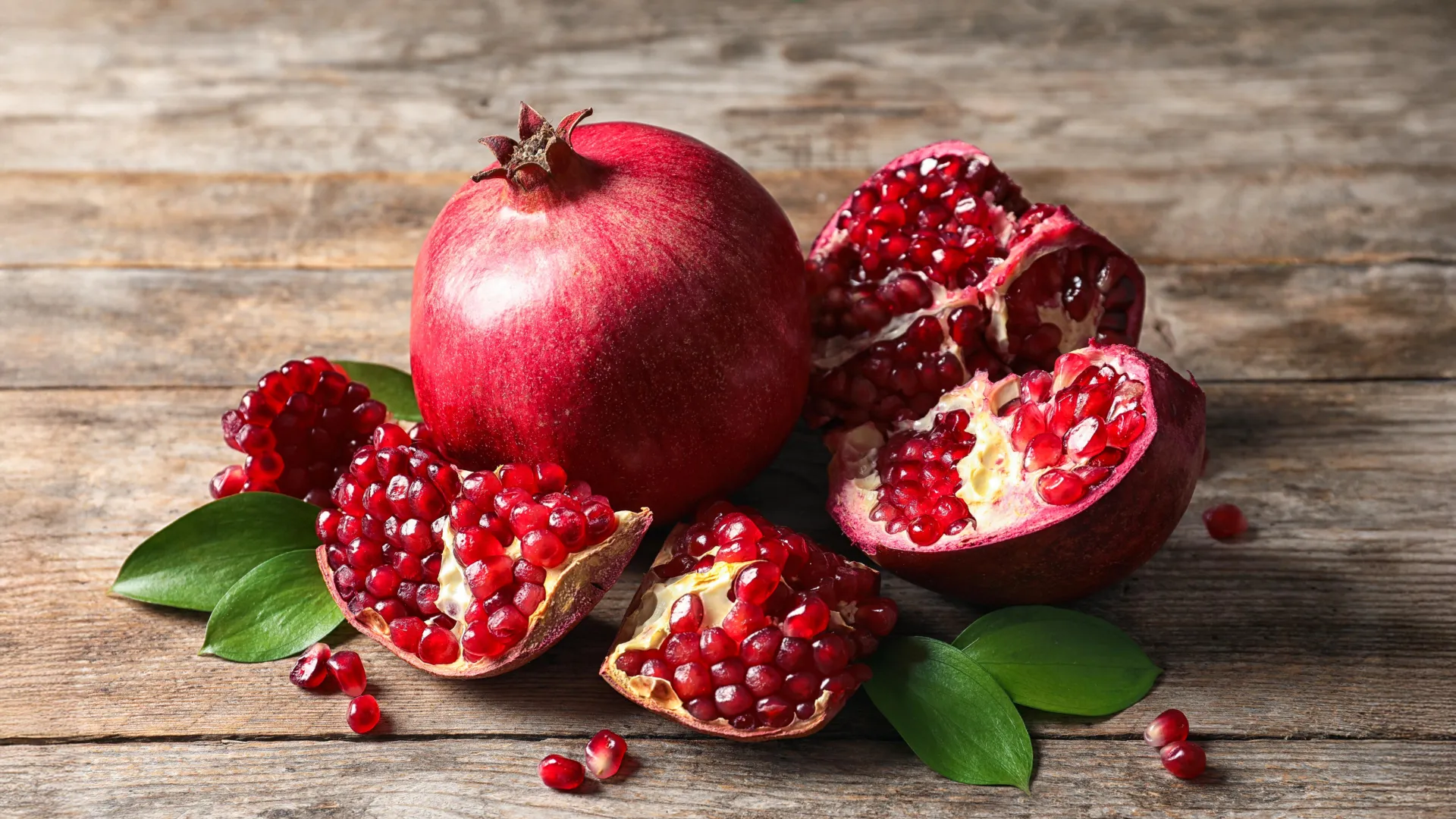 Fresh pomegranate and seeds highlighting research on a pomegranate compound and improved heart function